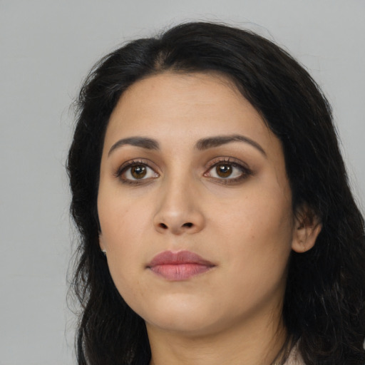 Neutral latino young-adult female with long  black hair and brown eyes