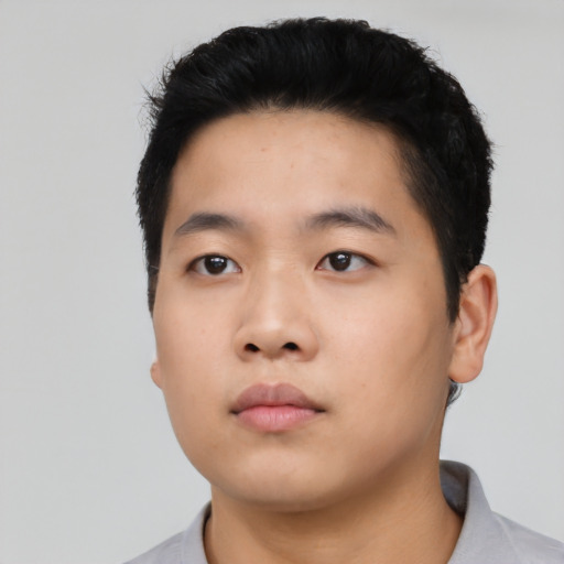 Neutral asian young-adult male with short  black hair and brown eyes