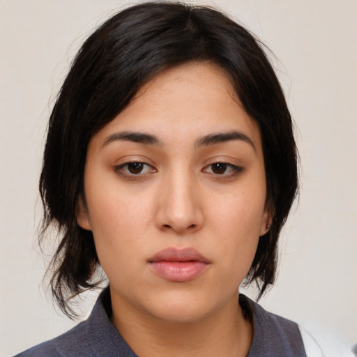 Neutral white young-adult female with medium  black hair and brown eyes