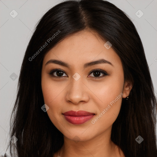 Joyful latino young-adult female with long  brown hair and brown eyes