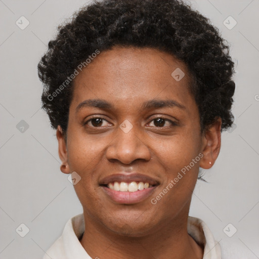 Joyful black young-adult female with short  brown hair and brown eyes