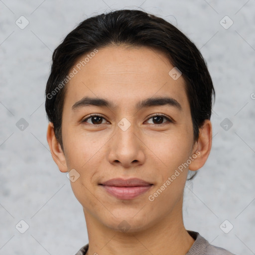 Joyful latino young-adult male with short  black hair and brown eyes