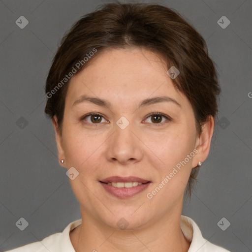 Joyful white adult female with short  brown hair and brown eyes