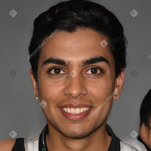 Joyful latino young-adult male with short  black hair and brown eyes