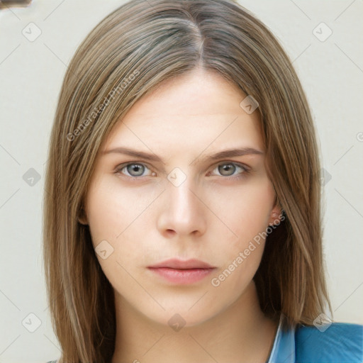 Neutral white young-adult female with long  brown hair and brown eyes