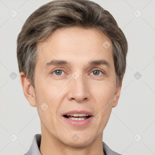 Joyful white adult male with short  brown hair and grey eyes