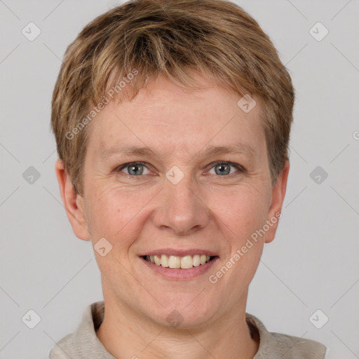 Joyful white adult male with short  brown hair and grey eyes