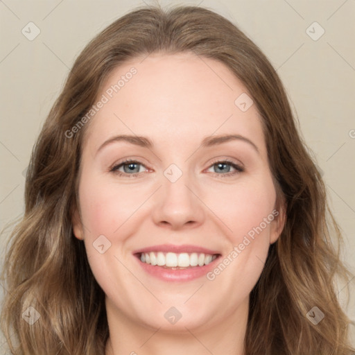 Joyful white young-adult female with long  brown hair and green eyes