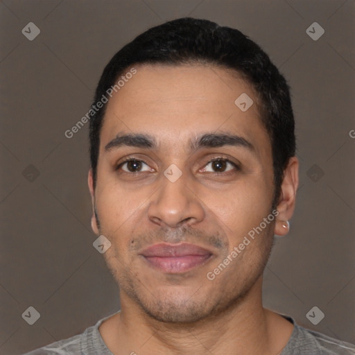 Joyful black young-adult male with short  black hair and brown eyes