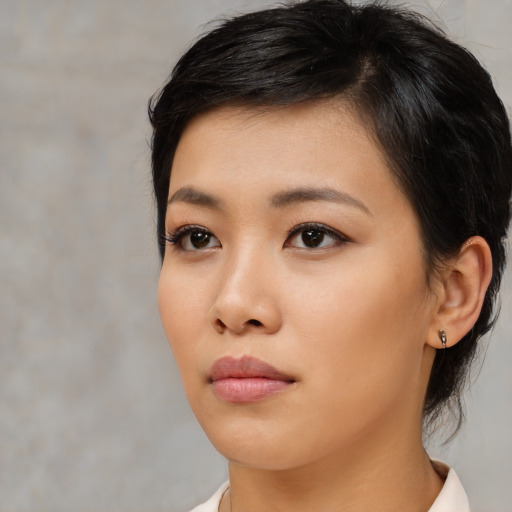 Neutral asian young-adult female with medium  black hair and brown eyes