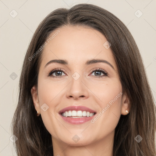 Joyful white young-adult female with long  brown hair and brown eyes