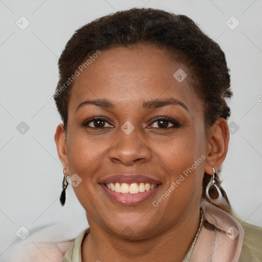 Joyful latino young-adult female with short  brown hair and brown eyes