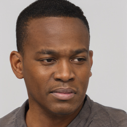 Neutral black young-adult male with short  brown hair and brown eyes