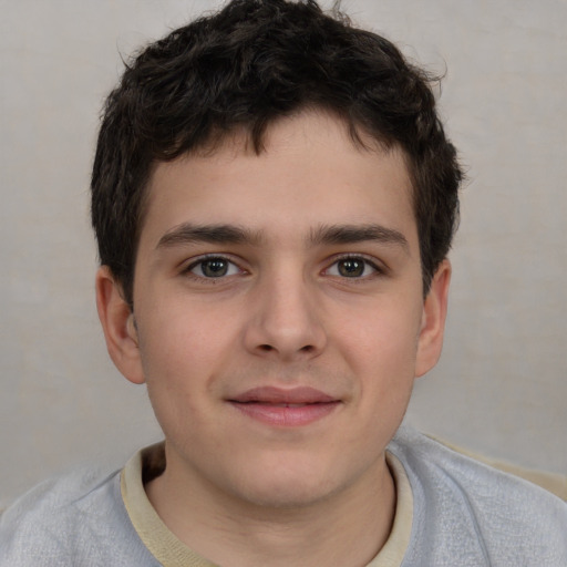 Joyful white child male with short  brown hair and brown eyes