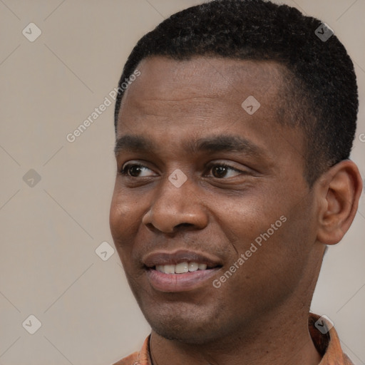 Joyful black young-adult male with short  black hair and brown eyes