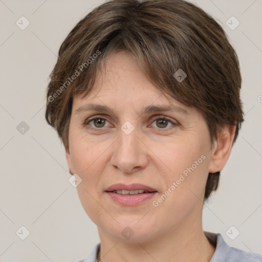 Joyful white adult female with medium  brown hair and grey eyes