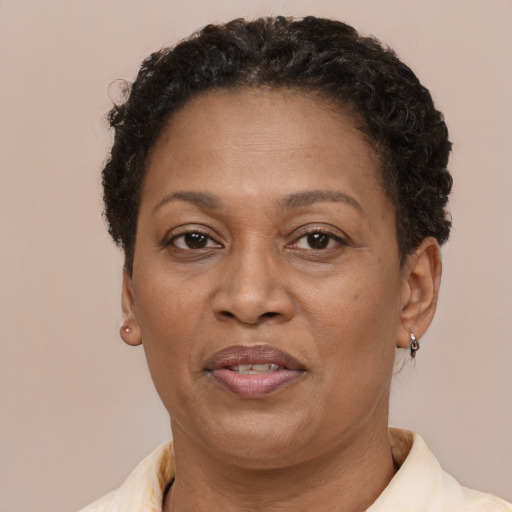 Joyful latino adult female with short  brown hair and brown eyes