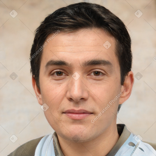 Joyful white young-adult male with short  black hair and brown eyes