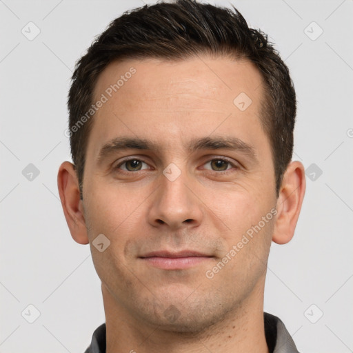 Joyful white young-adult male with short  brown hair and brown eyes