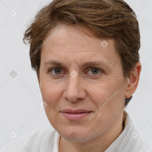 Joyful white adult female with short  brown hair and brown eyes