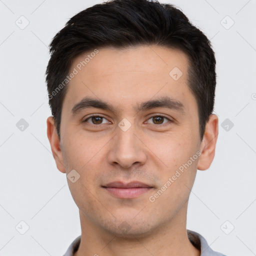 Joyful white young-adult male with short  black hair and brown eyes