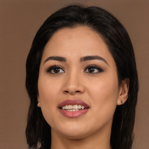 Joyful asian young-adult female with long  black hair and brown eyes