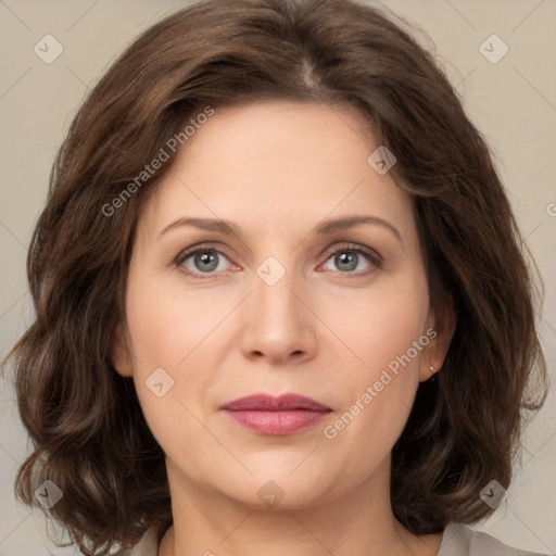 Joyful white young-adult female with medium  brown hair and green eyes