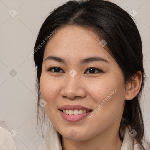 Joyful asian young-adult female with medium  brown hair and brown eyes