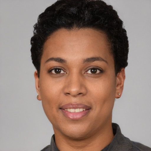 Joyful latino young-adult female with short  black hair and brown eyes