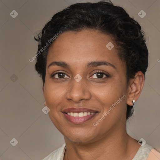 Joyful black young-adult female with short  brown hair and brown eyes