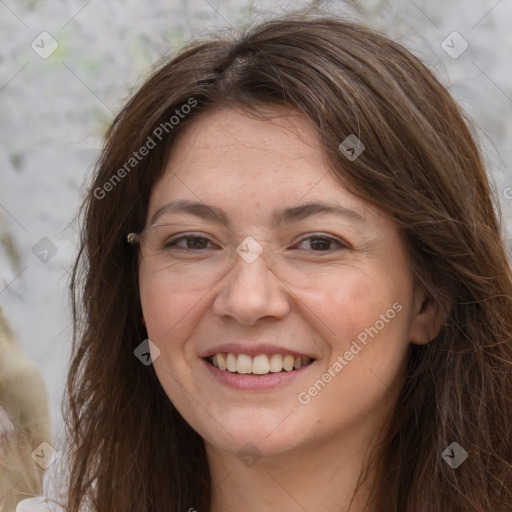 Joyful white adult female with long  brown hair and grey eyes