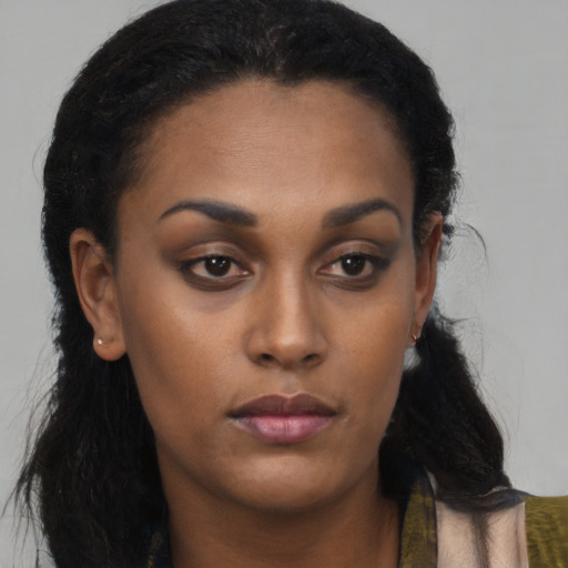 Neutral black young-adult female with long  brown hair and brown eyes