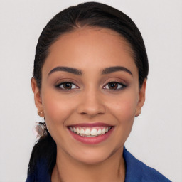 Joyful white young-adult female with long  black hair and brown eyes