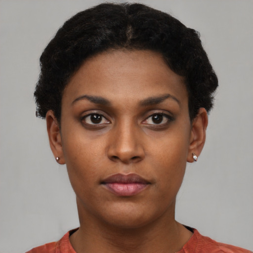 Neutral latino young-adult female with short  brown hair and brown eyes