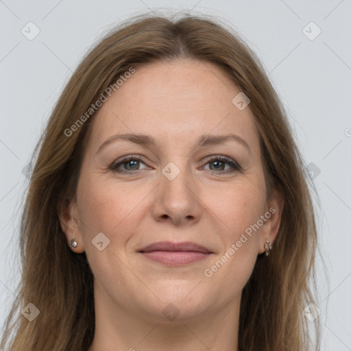 Joyful white adult female with long  brown hair and grey eyes