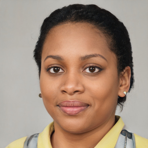Joyful latino young-adult female with short  black hair and brown eyes