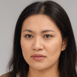 Joyful white young-adult female with long  brown hair and brown eyes