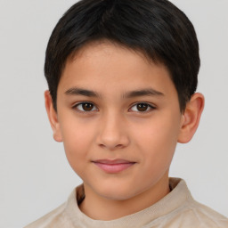 Joyful white child male with short  brown hair and brown eyes