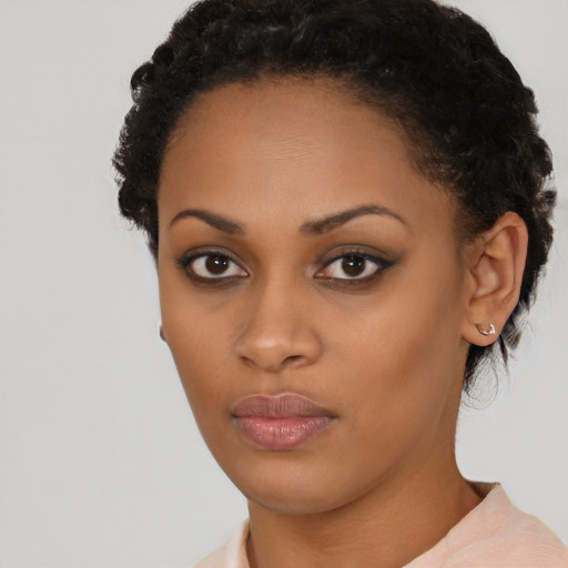 Neutral latino young-adult female with short  brown hair and brown eyes