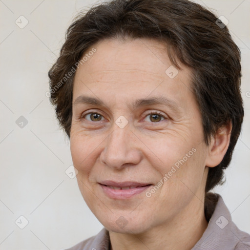 Joyful white adult female with short  brown hair and brown eyes