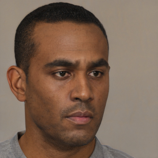 Neutral black young-adult male with short  black hair and brown eyes