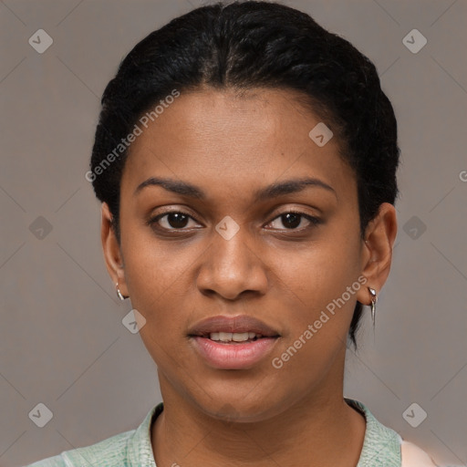 Joyful black young-adult female with short  black hair and brown eyes