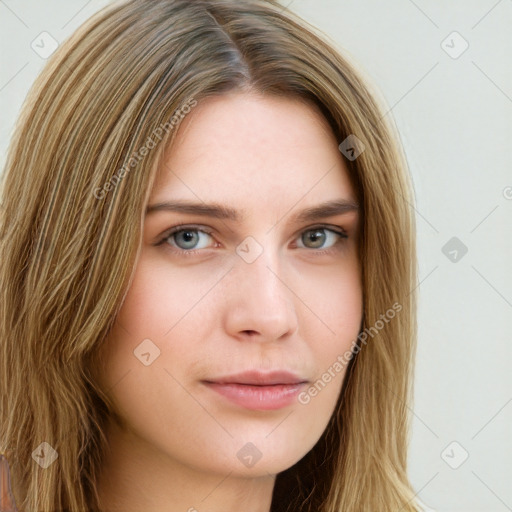 Neutral white young-adult female with long  brown hair and brown eyes