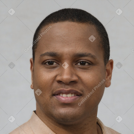 Joyful latino young-adult male with short  brown hair and brown eyes