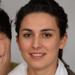 Joyful white young-adult female with medium  brown hair and brown eyes