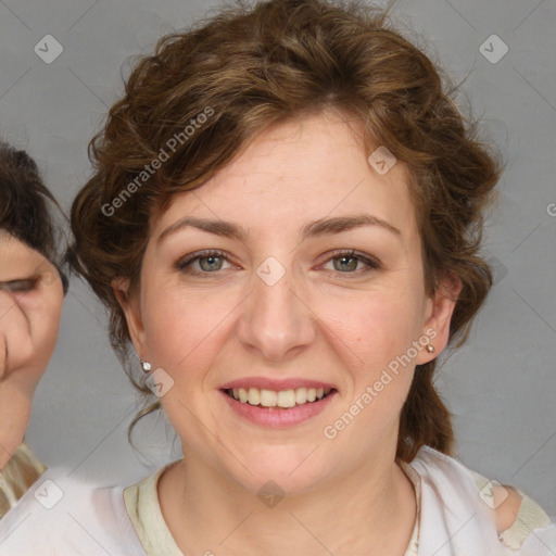 Joyful white young-adult female with medium  brown hair and blue eyes