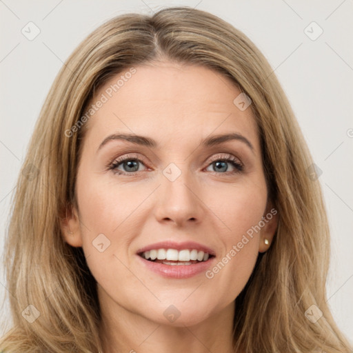 Joyful white young-adult female with long  brown hair and green eyes