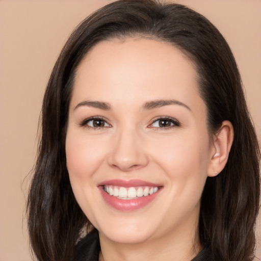 Joyful white young-adult female with long  brown hair and brown eyes