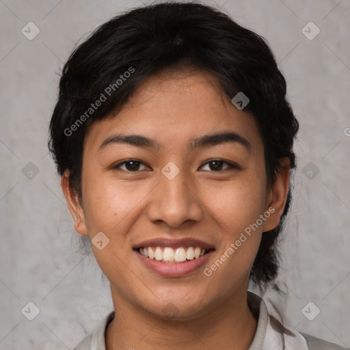 Joyful asian young-adult female with short  black hair and brown eyes