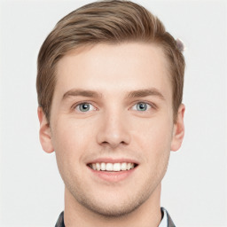 Joyful white young-adult male with short  brown hair and grey eyes